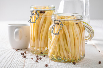 Preparation for pickled green bean with allspice and salt.