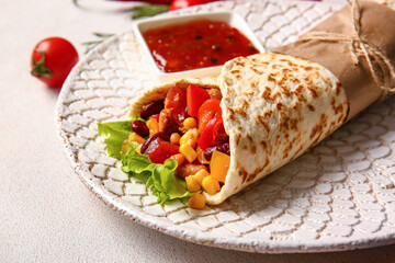 Fototapeta na wymiar Plate with delicious burrito and sauce on light background, closeup