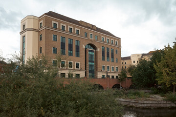 Fototapeta na wymiar Houses by Kennet River in town centre of Reading, United Kingdom