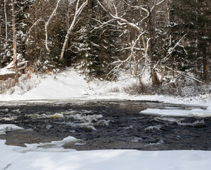 Fototapeta na wymiar Oxtongue River in Dwight Ontario in winter