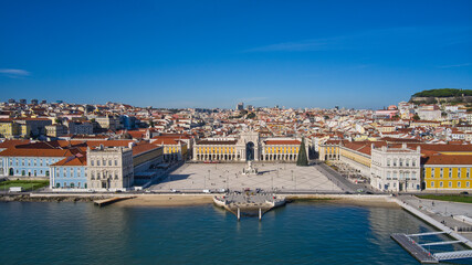 Fototapeta na wymiar Aerial drone view of the Augusta Street Arch from Commerce Square in Lisbon, Portugal. Sunny day with blue sky. Joseph I portuguese king statue.