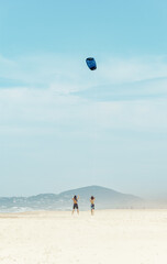 Instructor Teaching Young Man to Kitesurfing on a Beach in Noosa Heads,Queensland,Australia