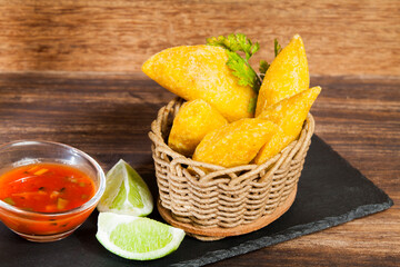 Delicious empanadas, Colombian cuisine. on the wooden table
