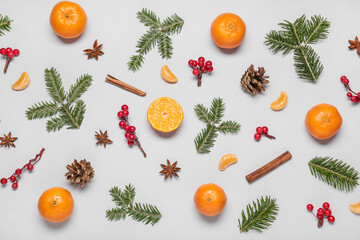 Composition with tangerines, fir branches and spices on white background