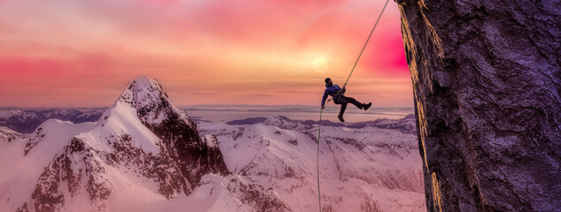 Adult adventurous man rappelling down a rocky cliff. Extreme adventure composite. 3d rendering mountain artwork. Aerial background landscape from British Columbia, Canada.