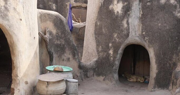 Tongo Hills Tengzug Shrines round rock and mud homes Ghana. The Tengzug Shrine, famous once a hideout for slaves evading their captors. Traditionally for religious animal sacrifices. Talensis homes.