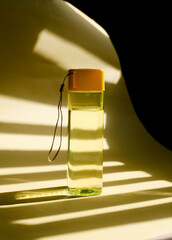 close up reusable plastic water bottle, reusable yellow water bottle