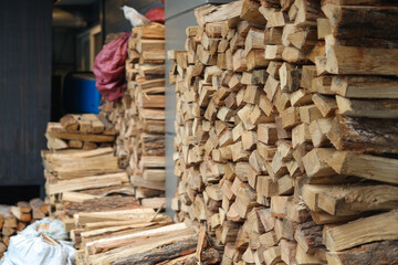 A lot of firewood is piled up.