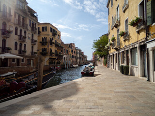 Fototapeta na wymiar Venice Canal During a Peaceful Sunny Day
