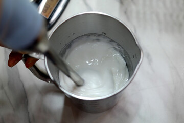 Put the white ingredients in a stainless measuring cup and stir.