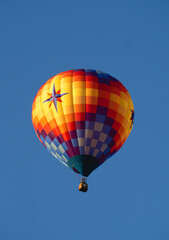 Hot Air Balloon Floating in Clear Blue Sky