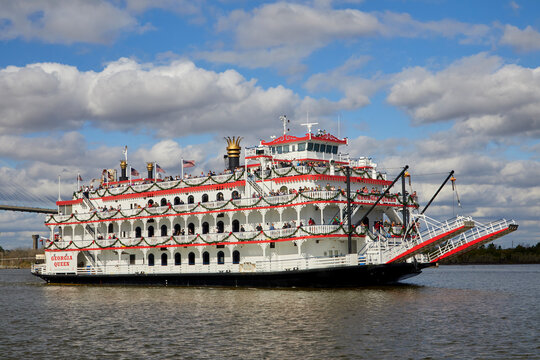 Majestic paddlewheel riverboat replica cruising the historic and vibrant port of Savannah Georgia USA