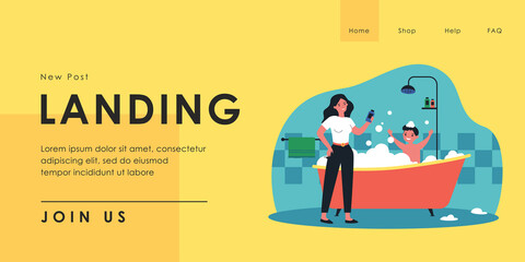 Mother bathing happy son in bathtub