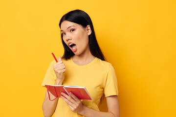 Portrait Asian beautiful young woman with a notebook and pen in hand Lifestyle unaltered