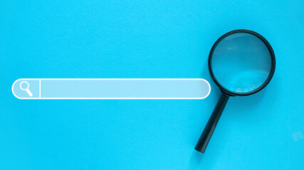 Magnifying glass with a search bar icon.