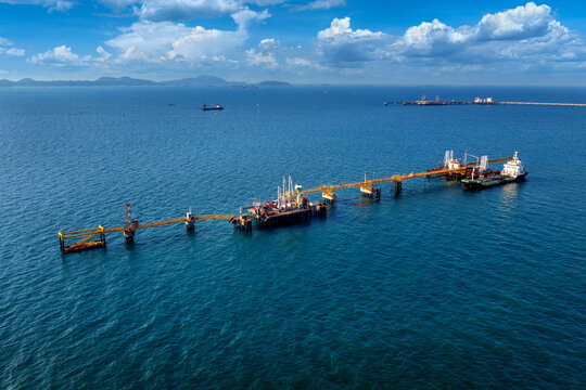 Aerial view of offshore oil and gas rig drilling.