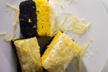 Bolu keju is Indonesian slice cake with cheese topping