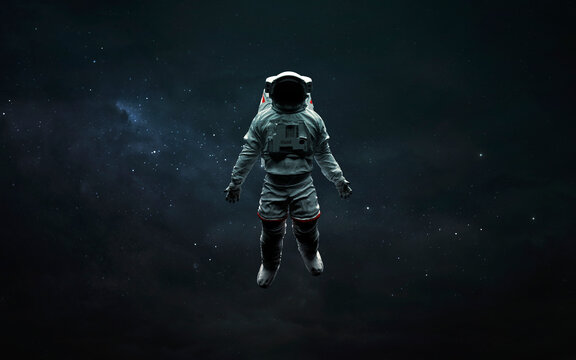 Astronaut at spacewalk in deep space. 3D sci-fi art. Elements of image provided by Nasa