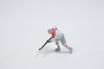 a puck during the game,  Professional Player Shooting