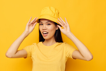 woman casual wear studio hand gesture yellow background unaltered