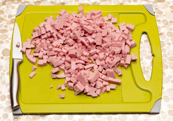 Sliced sausage on a board.