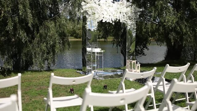 Beautiful wedding arch for the ceremony near the lake