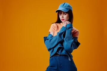 Beautiful fashionable girl denim cap red lips glamor fashion color background unaltered