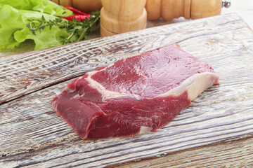 Raw rib-eye beef steak black angus