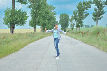 Fototapeta premium beautiful girl posing in a wheat field.