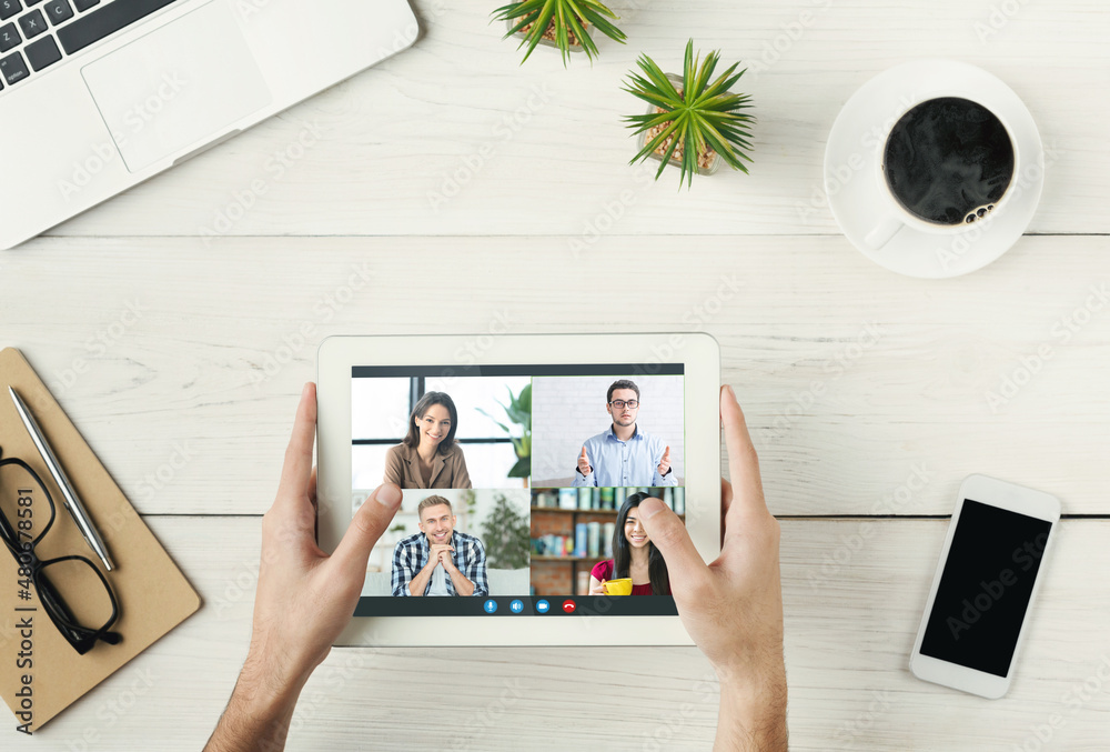 Aufkleber unrecognizable man holding digital tablet with group video conference interface on screen