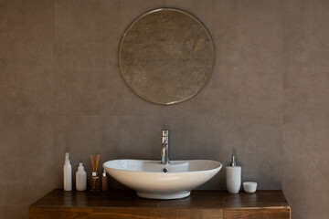 Modern bathroom interior in luxury apartment, sink with mirror
