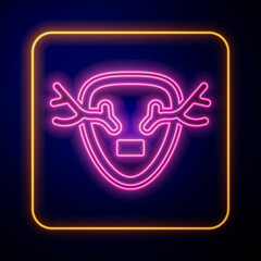 Glowing neon Deer antlers on shield icon isolated on black background. Hunting trophy on wall. Vector