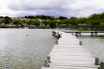 Fototapeta na wymiar wood pontoon lake of Peyriac de-Mer France across the water
