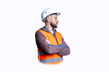 Pensive civil engineer in helmet with crossed arms on light background.