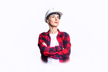Young woman in construction clothes with folded hands on a light background.