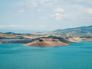 Beautiful futuristic views of the canyon and reservoir, Chirkeyskoye reservoir is the largest artificial reservoir in the Caucasus. It is located on the Sulak River. Dagestan. Russia. Remote view.