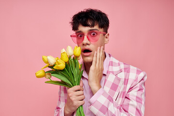portrait of a young man pink glasses checkered jacket fashion posing isolated background unaltered