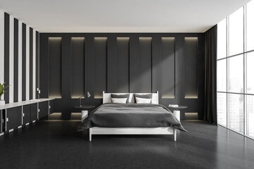 Dark bedroom interior with bed on carpet, concrete floor, panoramic window