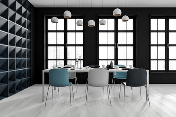 Black and white dining interior with six seats and table near window