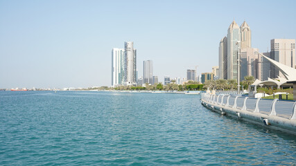 City skyline with big skyscrapers near the beach of Abu Dhabi, United Arab Emirates.