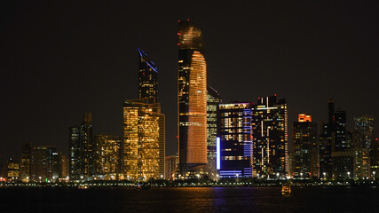 Fototapeta na wymiar City skyline with big skyscrapers near the beach of Abu Dhabi, United Arab Emirates.