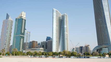 Fototapeta na wymiar City skyline with big skyscrapers near the beach of Abu Dhabi, United Arab Emirates.