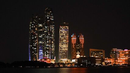 City skyline with big skyscrapers near the beach of Abu Dhabi, United Arab Emirates.