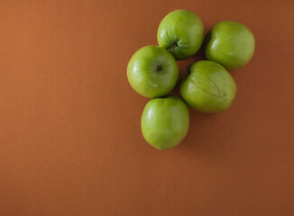 green Kul fruit or indian jujube or chinese date used for offering in bengali indian hindu festival saraswati puja and vasant panchami.