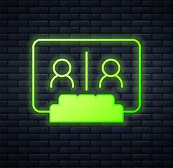 Glowing neon Video chat conference icon isolated on brick wall background. Online meeting work form home. Remote project management. Vector