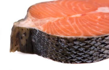 a cut piece of fresh salmon for steak. solated on white