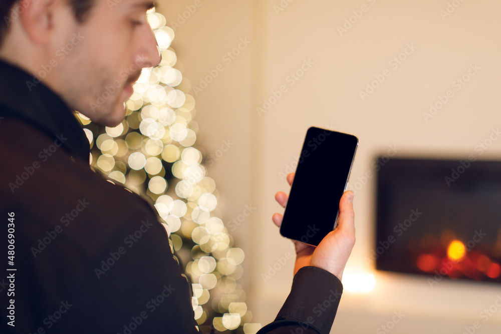 Poster Man holding phone with empty mockup screen