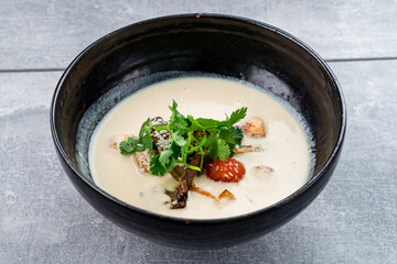 Traditional Thai food Tom Kha Gai in bowl Copy space