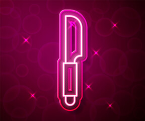 Glowing neon line Knife icon isolated on red background. Cutlery symbol. Vector