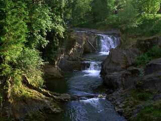 Beautiful high waterfall in summer